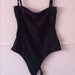 Black and white bodysuits with straps